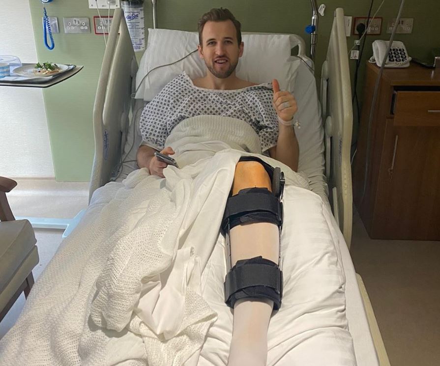 Harry Kane smiles in hospital after surgery on a hamstring injury