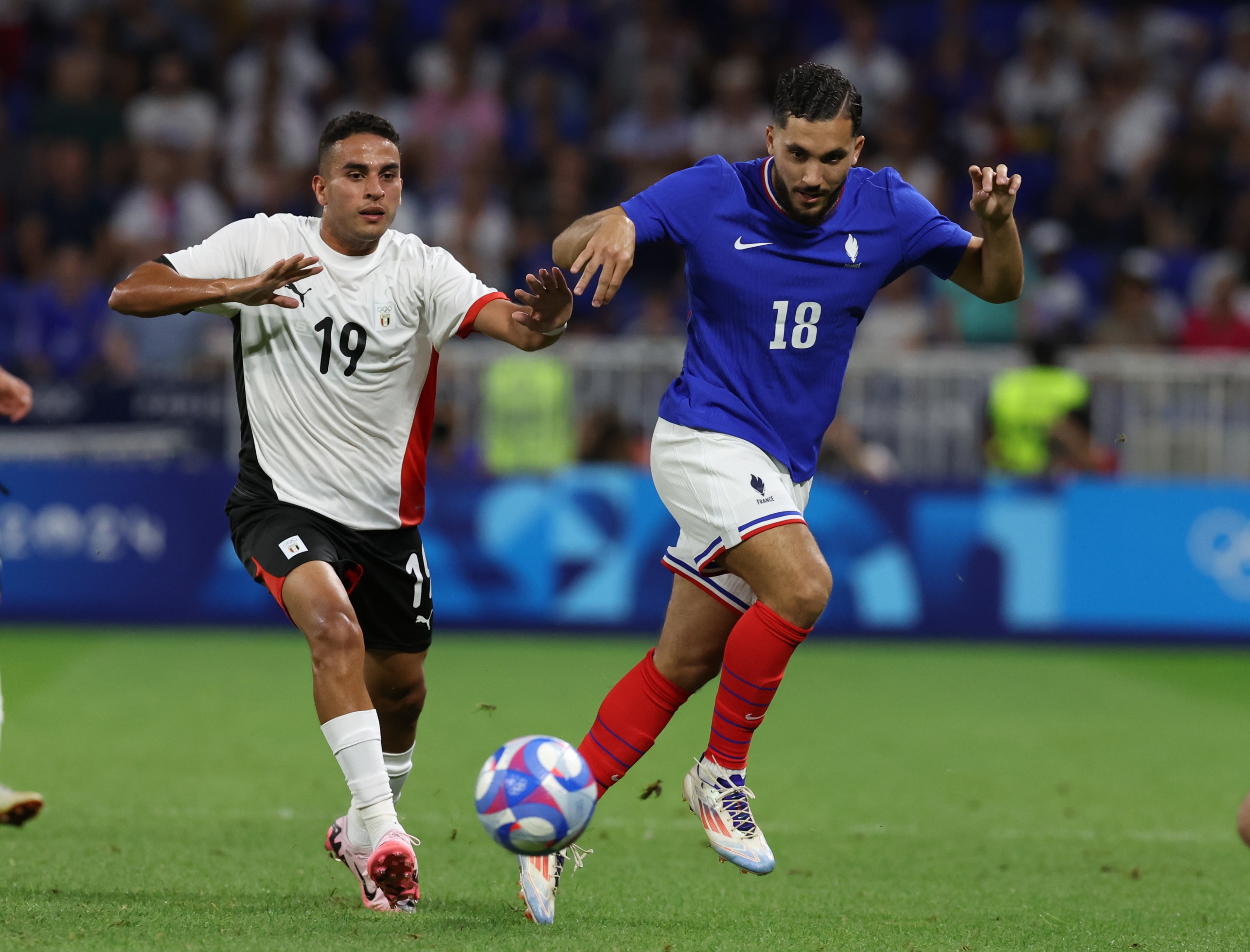 Tottenham target Rayan Cherki in action for France