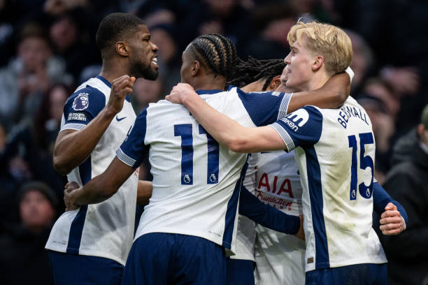 Tottenham players celebrating James Maddison's goal against Man United