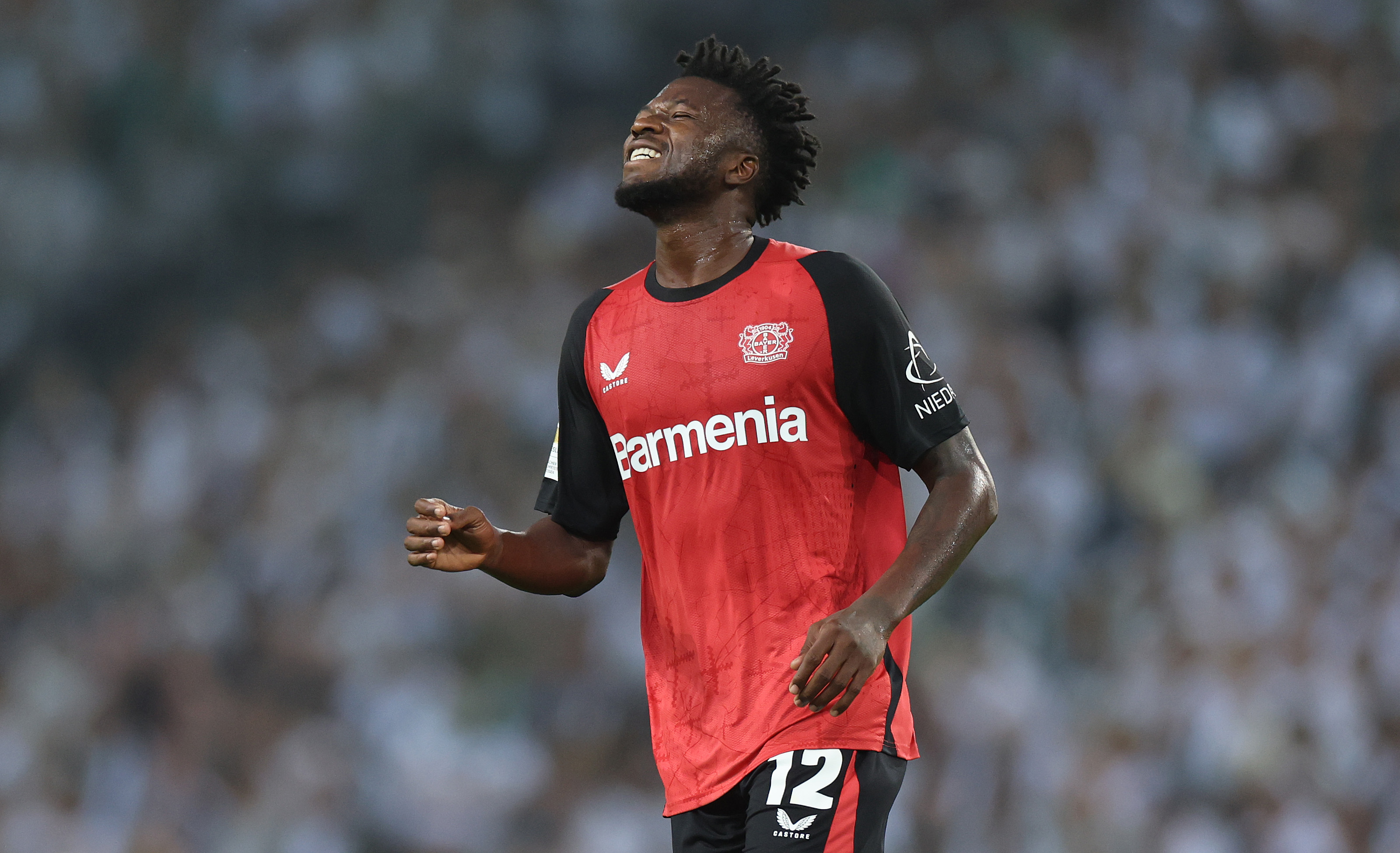 Edmond Tapsoba of Bayer Leverkusen reacts during a Bundesliga match