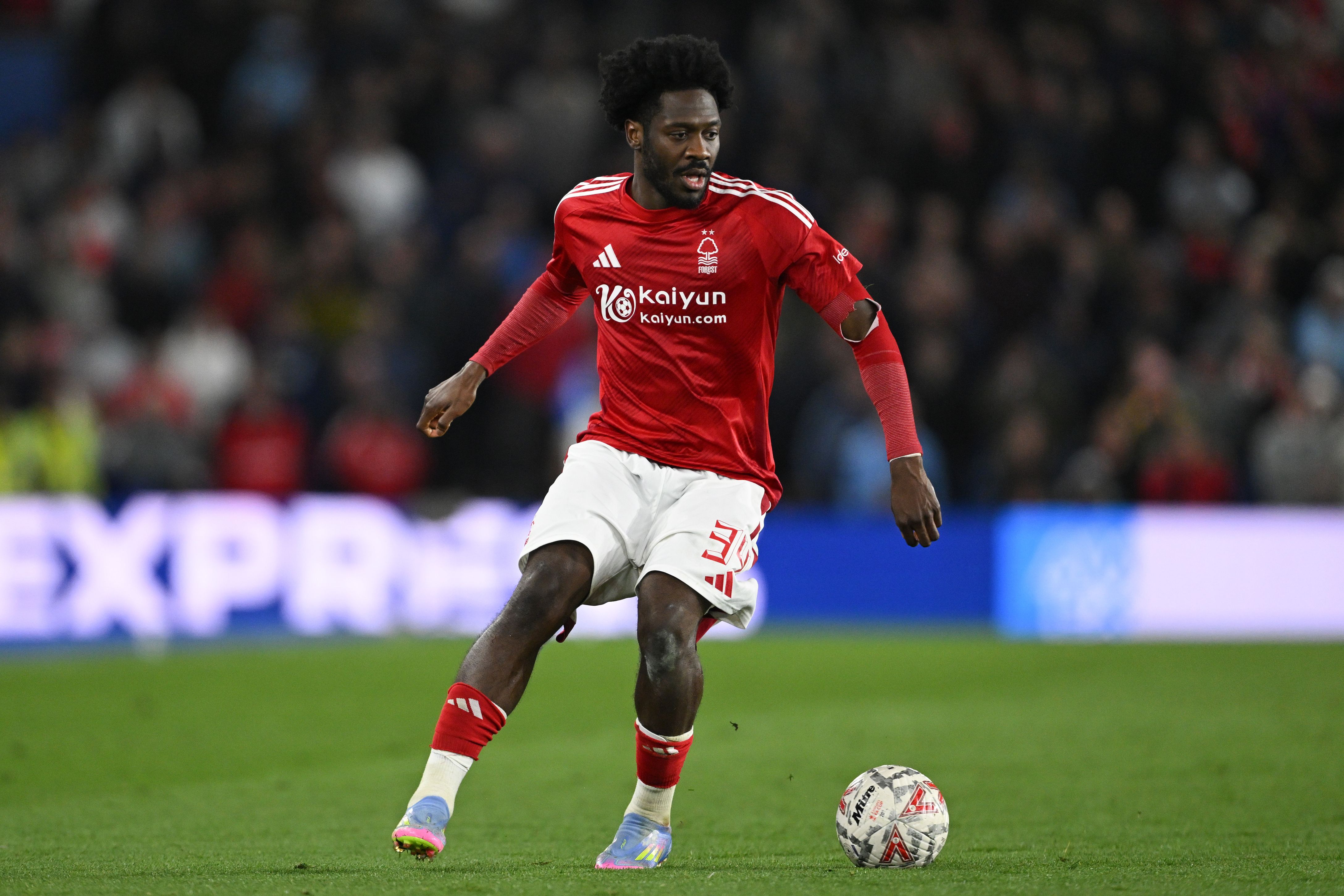 Ola Aina runs with the ball