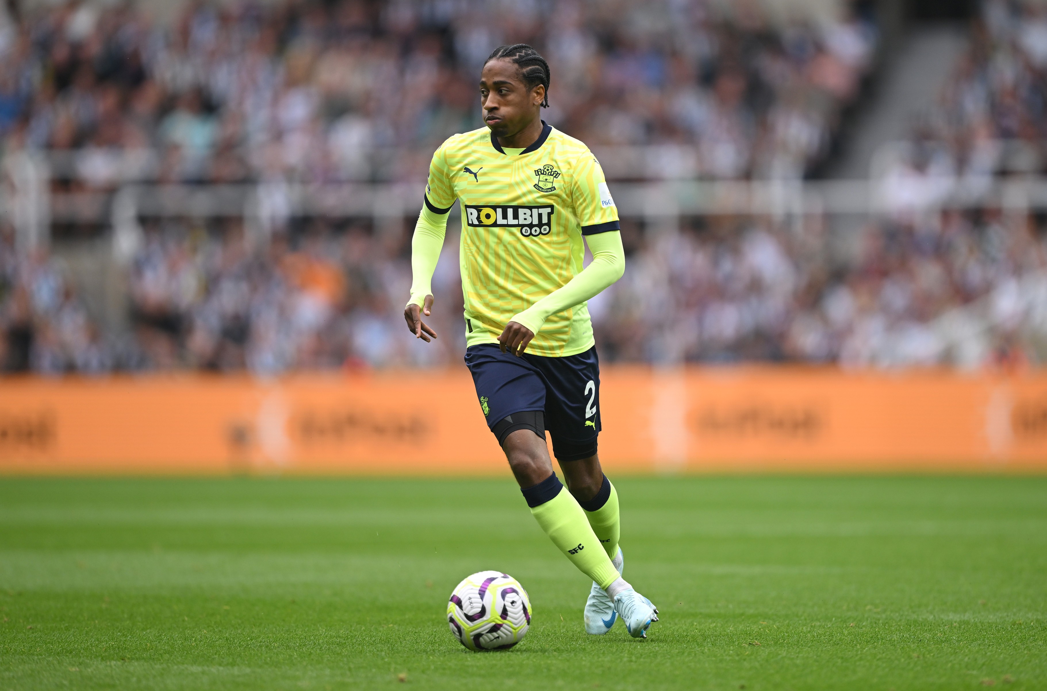 Kyle Walker-Peters runs with the ball