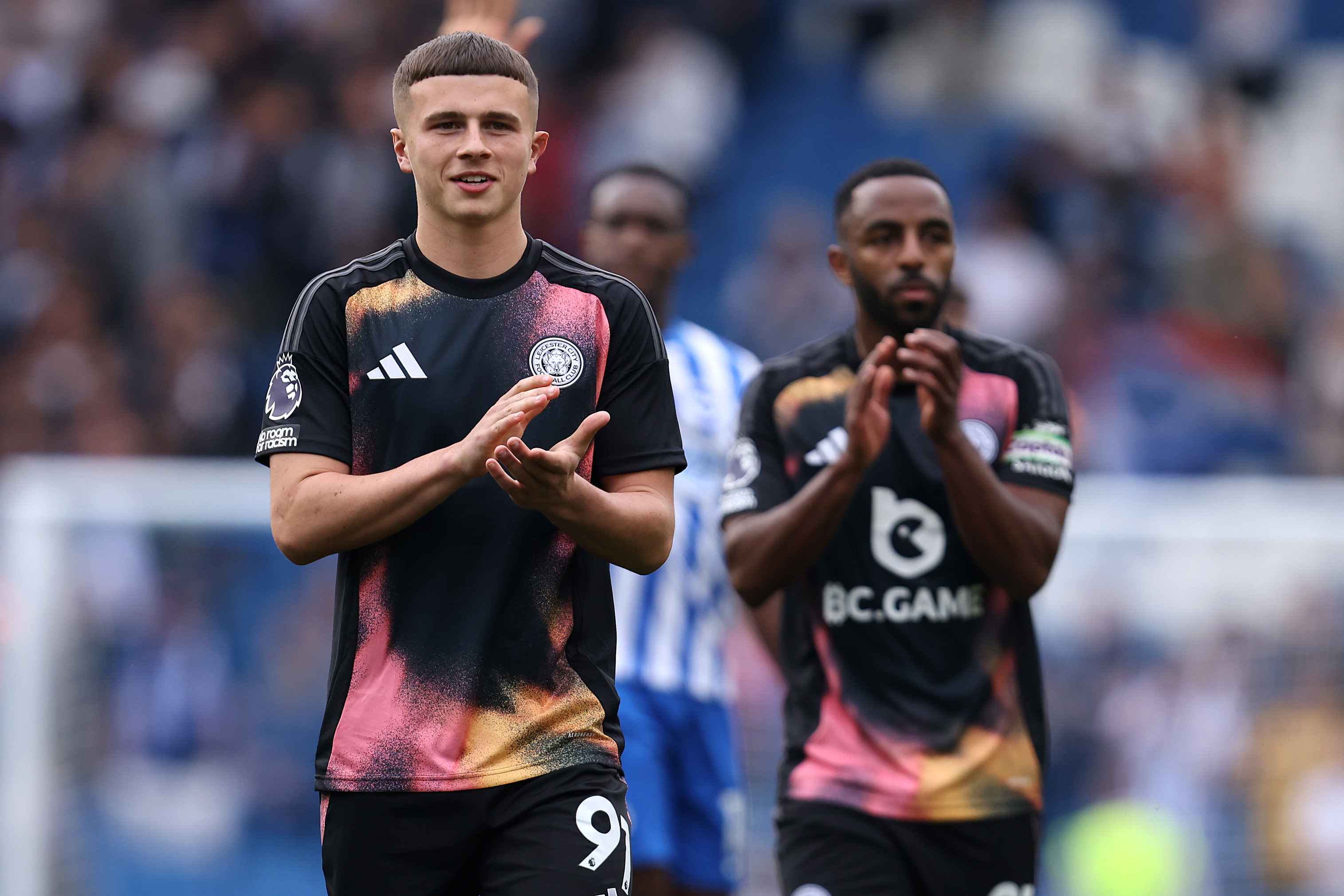 Jake Evans of Leicester City applauds the traveling away fans at the end of the game