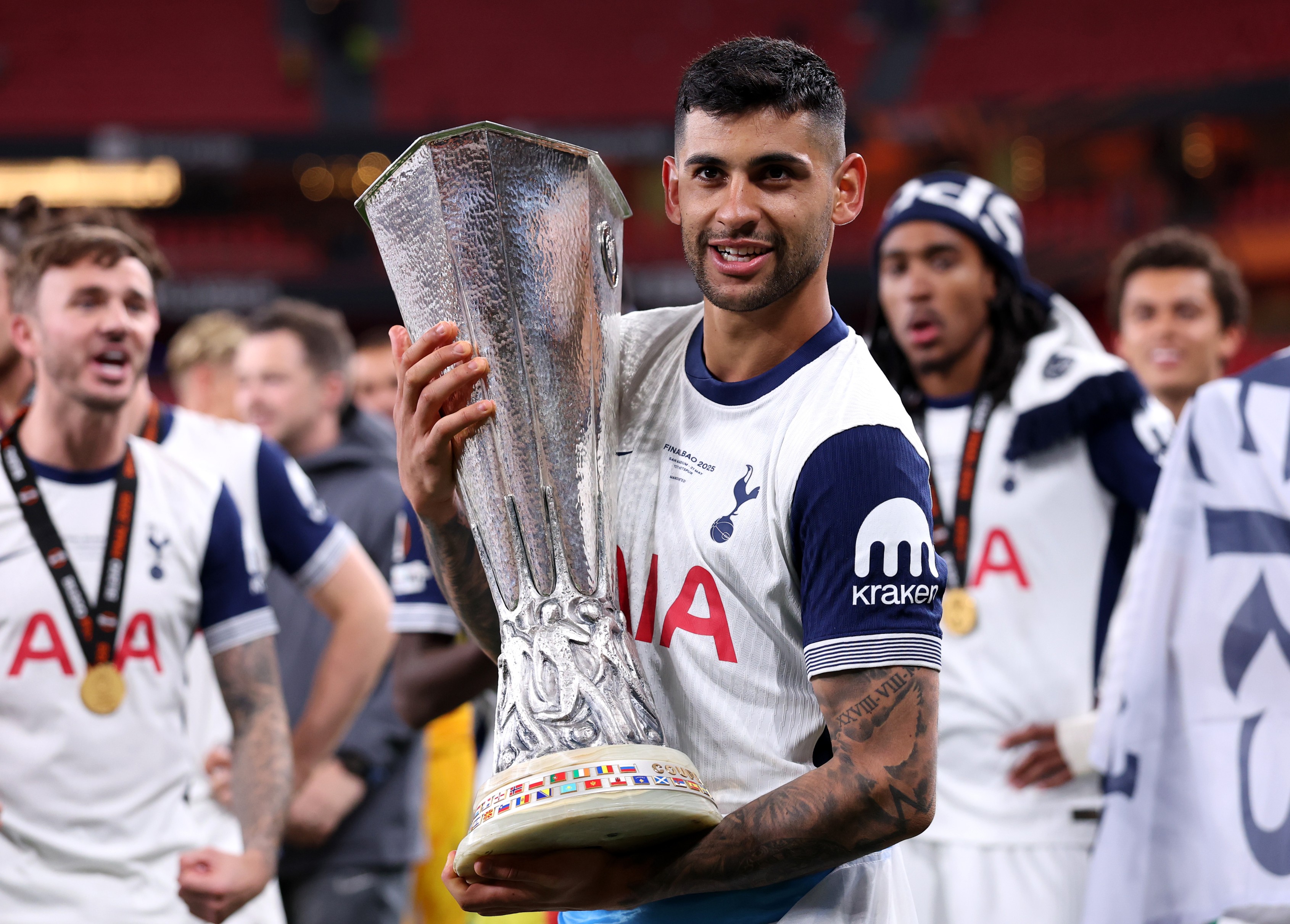 Cristian Romero of Tottenham Hotspur poses with the Europa League trophy