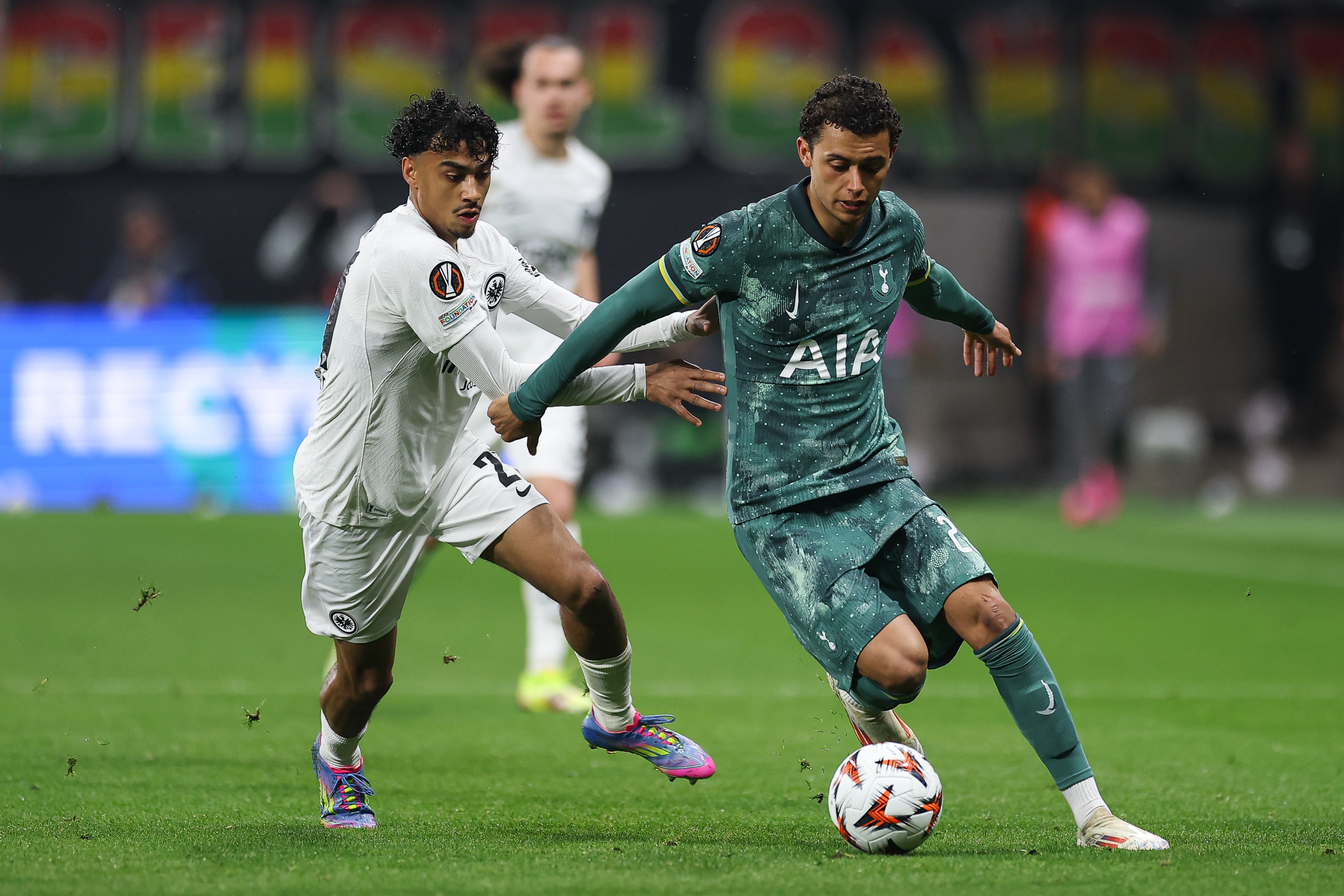 Nathaniel Brown of Eintracht Frankfurt battles for possession with Brennan Johnson of Tottenham Hotspur