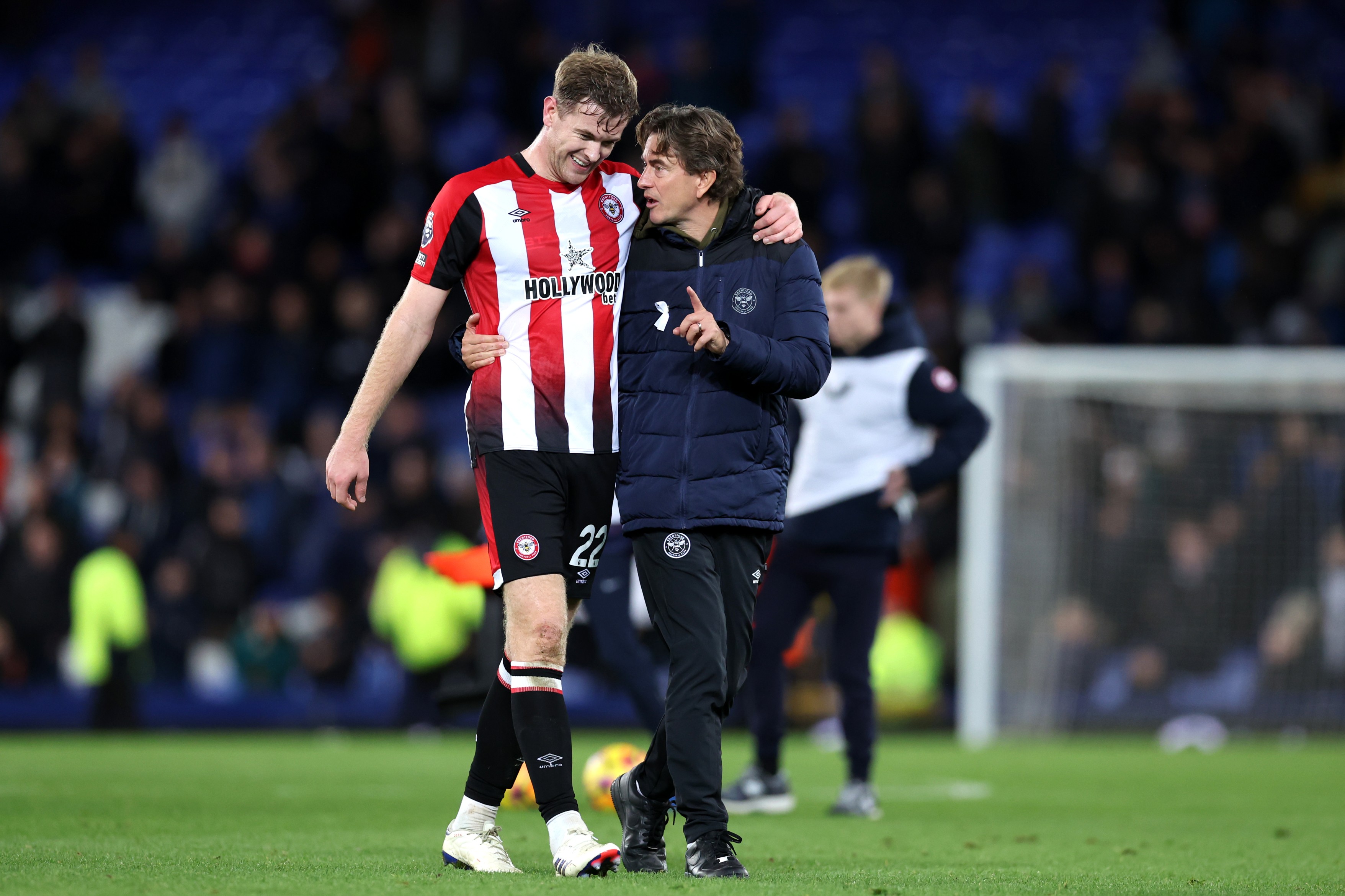 Nathan Collins of Brentford and Thomas Frank interact following a Premier League match