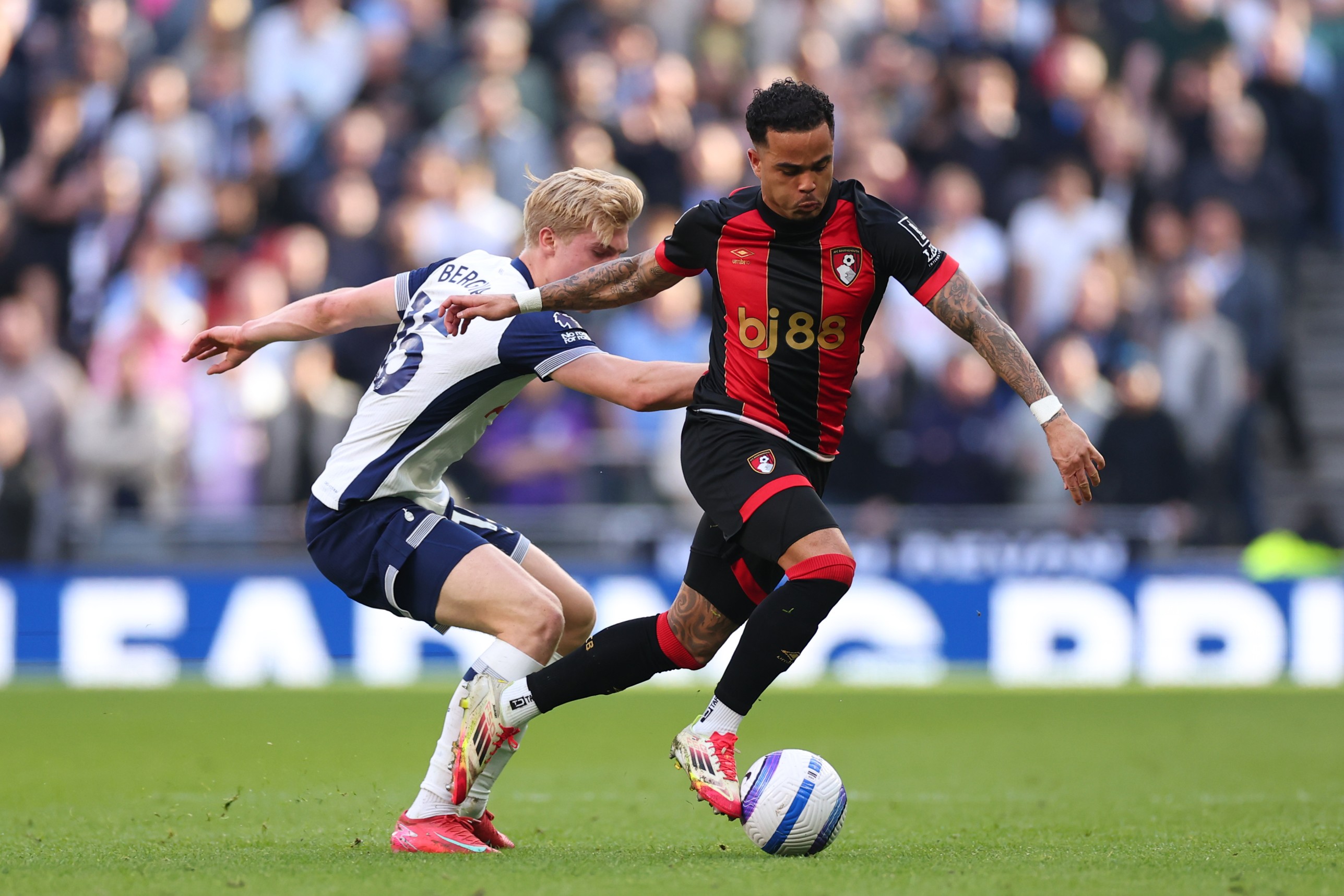 Lucas Bergvall of Tottenham Hotspur in action with Justin Kluivert of Bournemouth