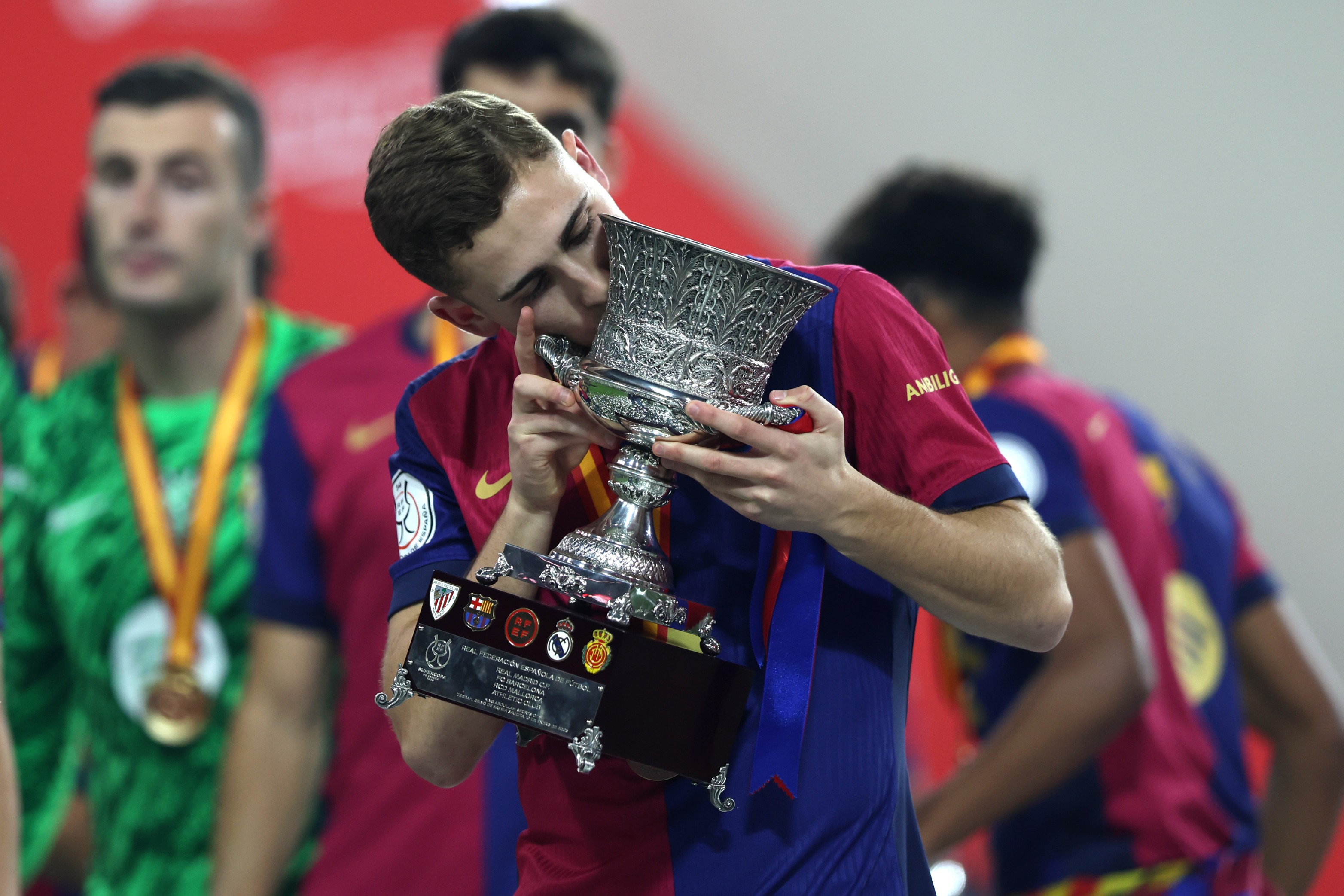 Fermin Lopez of FC Barcelona celebrates with the Supercopa de Espana winners' trophy