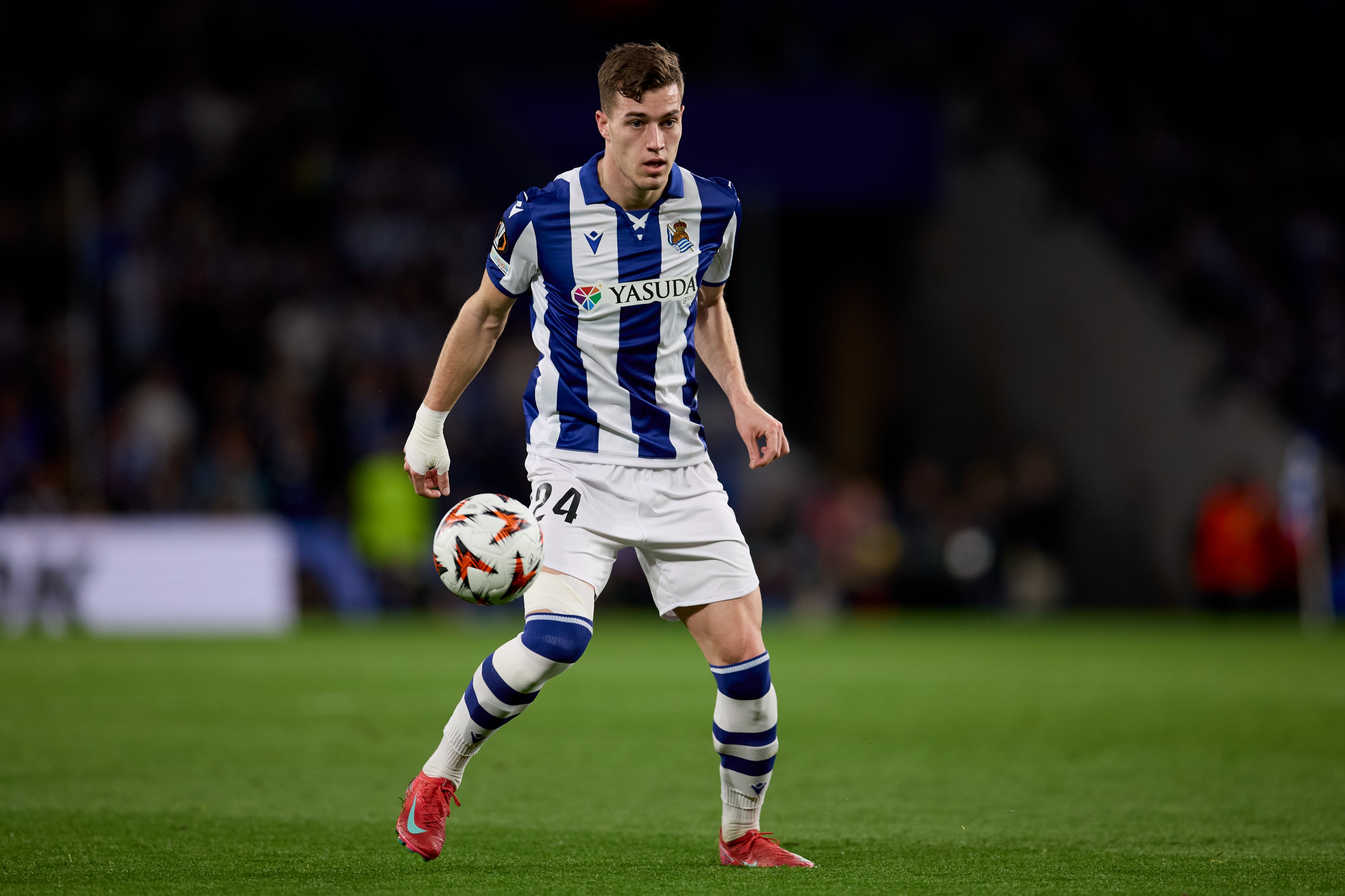 Luka Sucic of Real Sociedad runs with the ball during the UEFA Europa League 2024/25 Round of 16 First Leg match