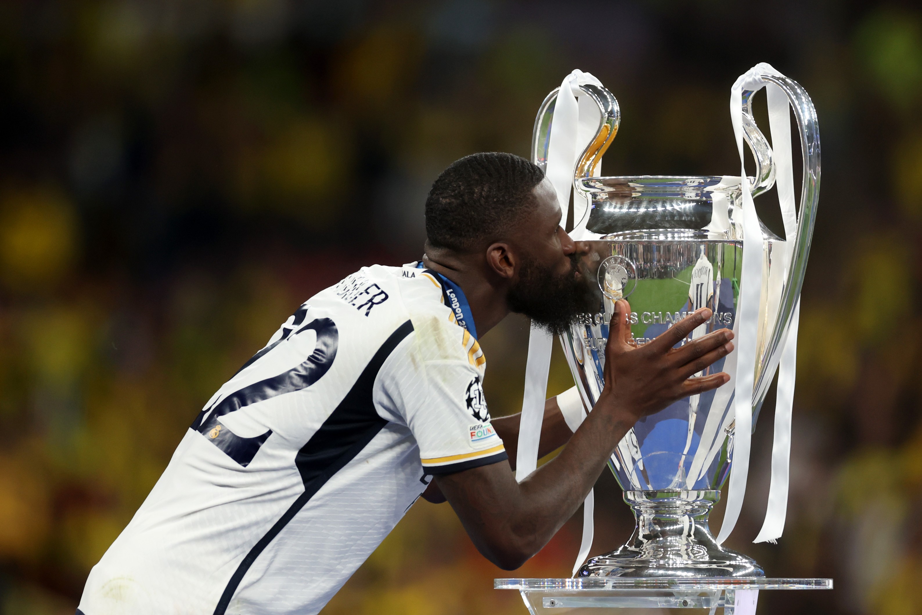 Antonio Rudiger of Real Madrid kisses the UEFA Champions League Trophy